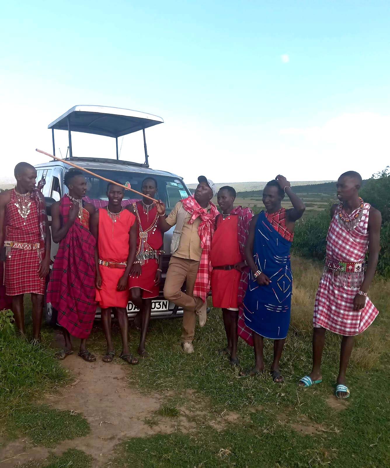 Maasai-Men-chatting-with-a-Safari-driver-Emars-Transport-and-Tours